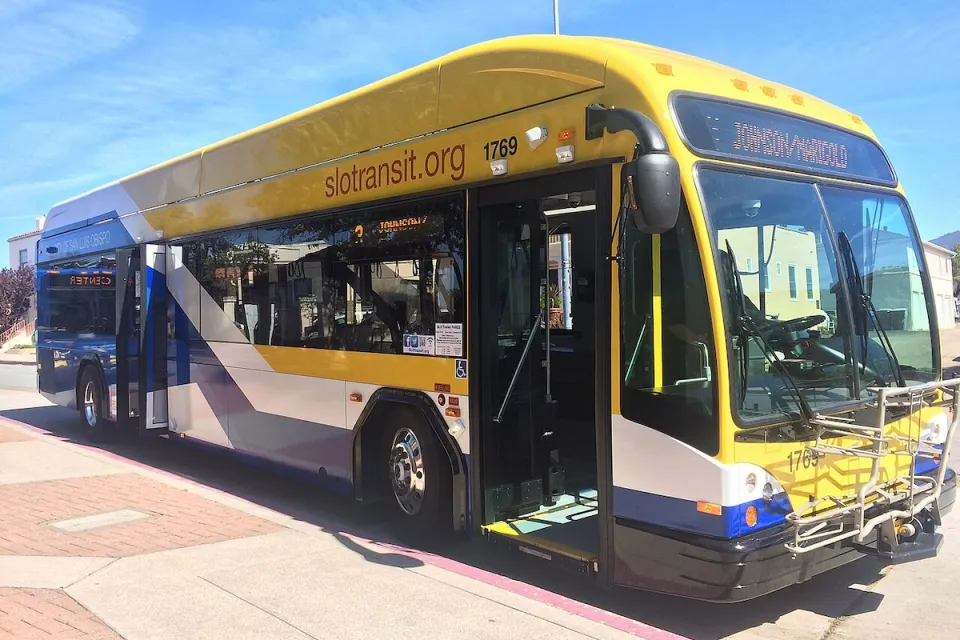 Blue and yellow 40-foot public transit bus in San Luis Obispo.